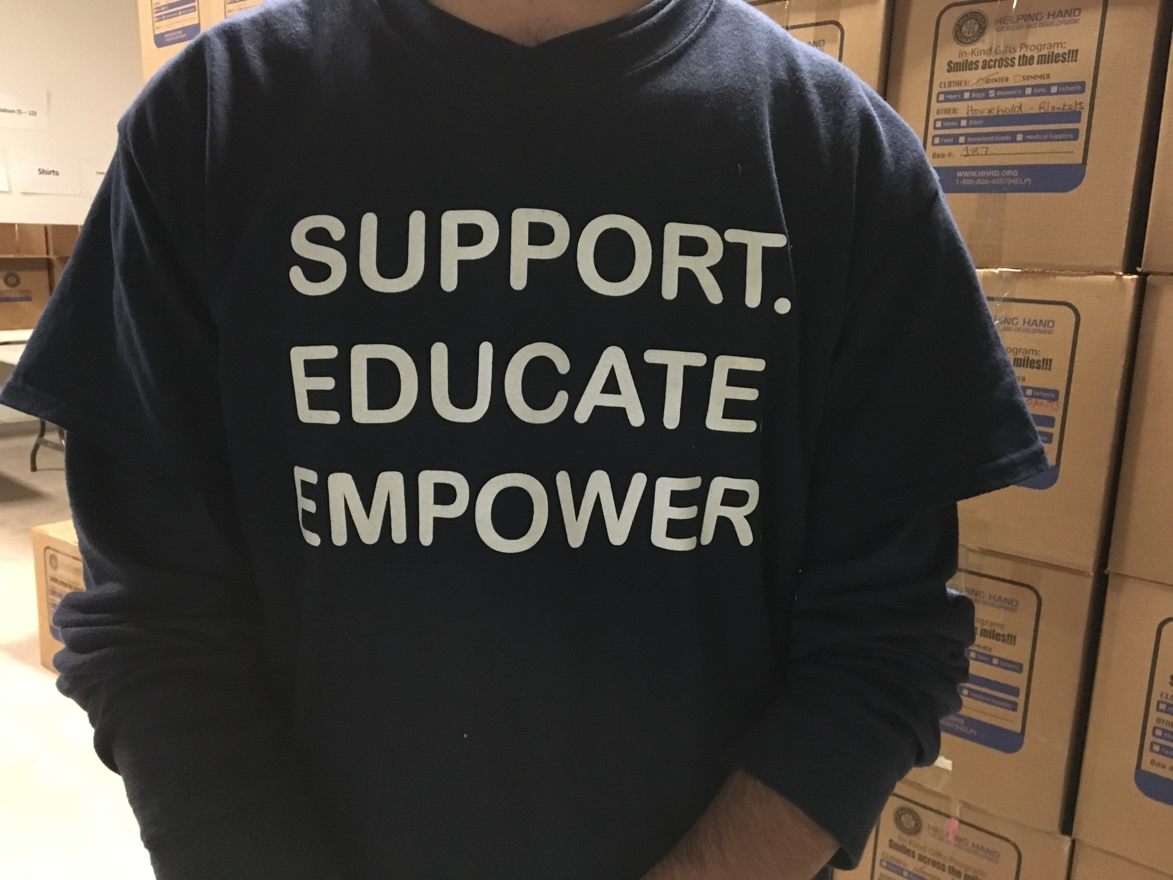 Mustafa's T-shirt reads Support, Educate, Empower